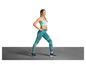 Une femme en leggings de sport bleus et un soutien-gorge de sport bleu clair debout sur un sol gris.