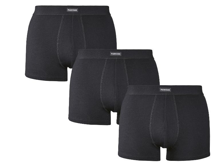Trois paires de boxers noirs pour hommes avec une ceinture visible.