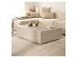Table basse rectangulaire en marbre avec canapé modulaire beige et tapis.