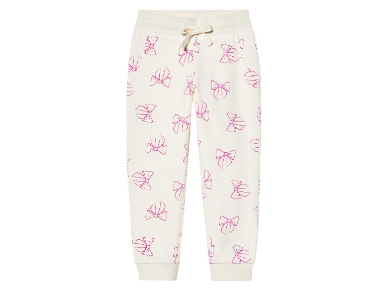 Jogging crème enfant, motif nœuds roses.