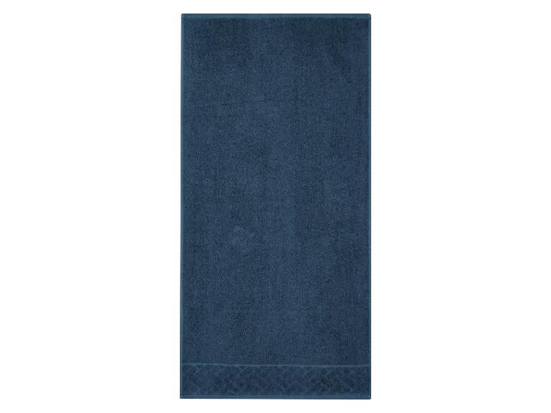 Serviette de bain bleu foncé avec motif décoratif en bas