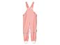 Salopette imperméable rose pour enfant.