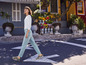 Une femme marche dans la rue avec un t-shirt blanc, un jean bleu et des baskets vertes.