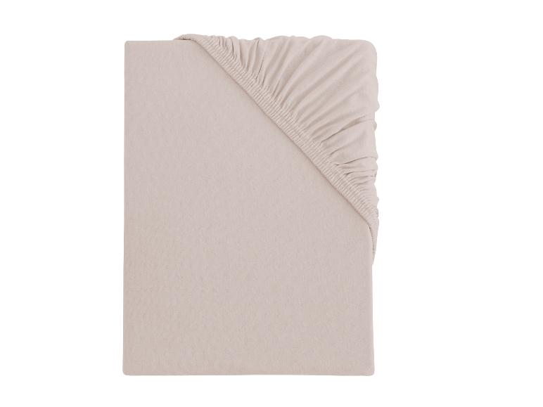 Drap-housse beige avec coins élastiques