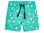 Shorts turquoise à motif palmiers et surfs.