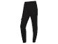 Pantalon de survêtement noir avec des poches et le logo Reebok.