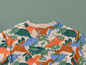 T-shirt beige à manches longues avec imprimé dinosaures