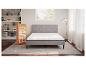 Matelas Emma Express et sommier gris dans une chambre.