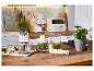 Appareils électroménagers de cuisine rétro : hachoir, mixeur plongeant et autres accessoires sur une table en bois.
