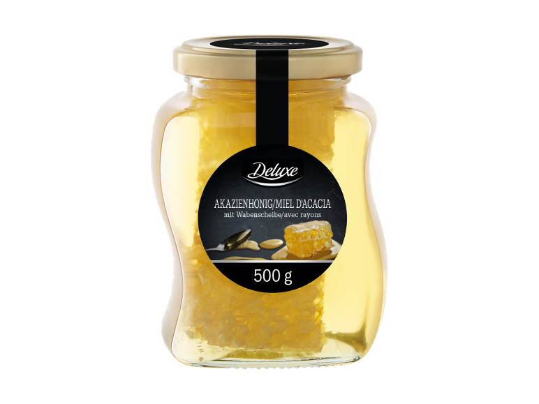Miel d'acacia avec rayon de miel dans un pot en verre, 500 g.