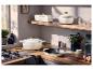 Gamme d'ustensiles de cuisine en fonte premium SILVERCREST® dans une cuisine moderne.
