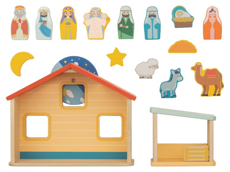 Ensemble de jeu en bois sur le thème de Noël, comprenant une maison, une crèche et des figurines.