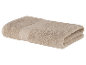 Une serviette beige pliée sur un fond blanc.