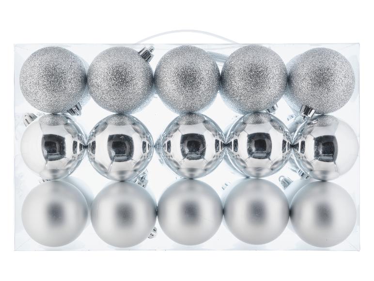 Ensemble de 15 boules de Noël argentées avec des finitions brillantes, mates et pailletées, dans une boîte transparente.
