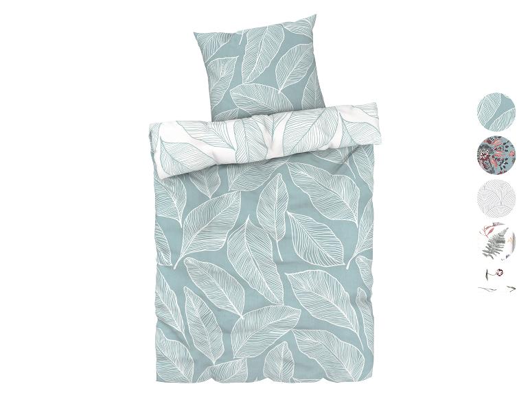 Une parure de lit avec un motif de feuilles botaniques.
