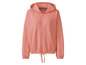 Un sweat à capuche rose à fermeture éclair