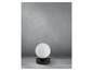 Une lampe de table noire avec un abat-jour rond blanc.