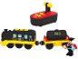 Train jouet noir et jaune avec télécommande et figurine de conducteur.