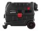 Un aspirateur noir avec des accents rouges et des roues.