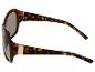 Lunettes de soleil écaille de tortue avec détail doré.
