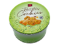 Boîte de biscuits au beurre de 750g avec un assortiment de biscuits et un motif de feuilles vertes.