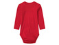 Un body bébé rouge à manches longues.
