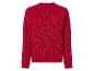 Un pull rouge en maille avec des paillettes.