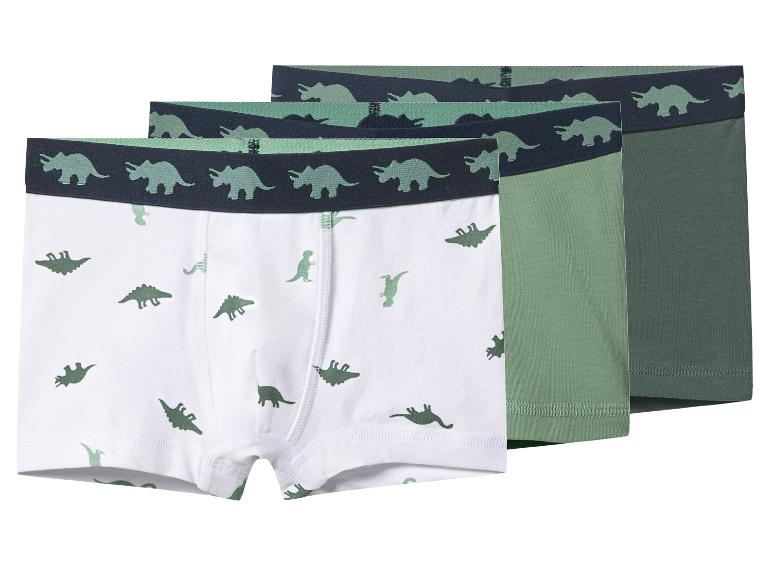 Trois boxers pour garçons à motif dinosaures en blanc, vert clair et vert foncé.