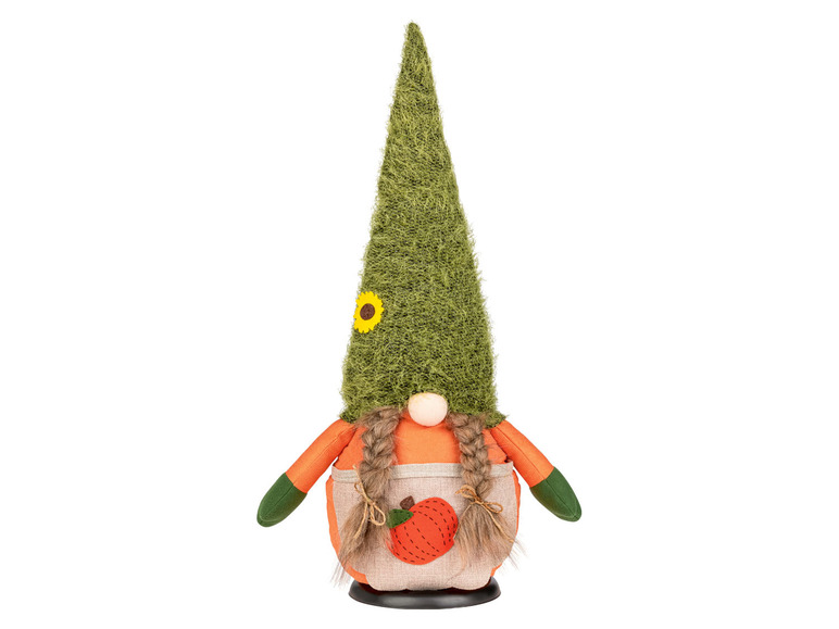 Un gnome en peluche avec un chapeau vert et une tenue orange.
