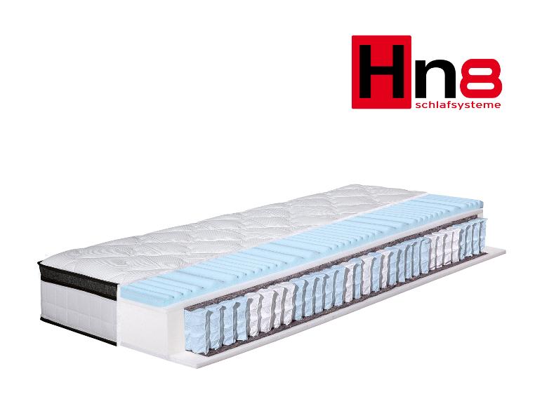 Matelas Hn8 Schlafysteme avec coupe transversale montrant les couches internes et les ressorts ensachés.