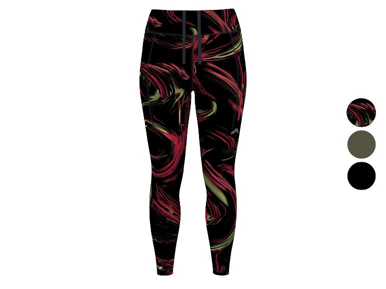 Legging de sport avec motif abstrait dans les tons rouges et verts sur fond noir.