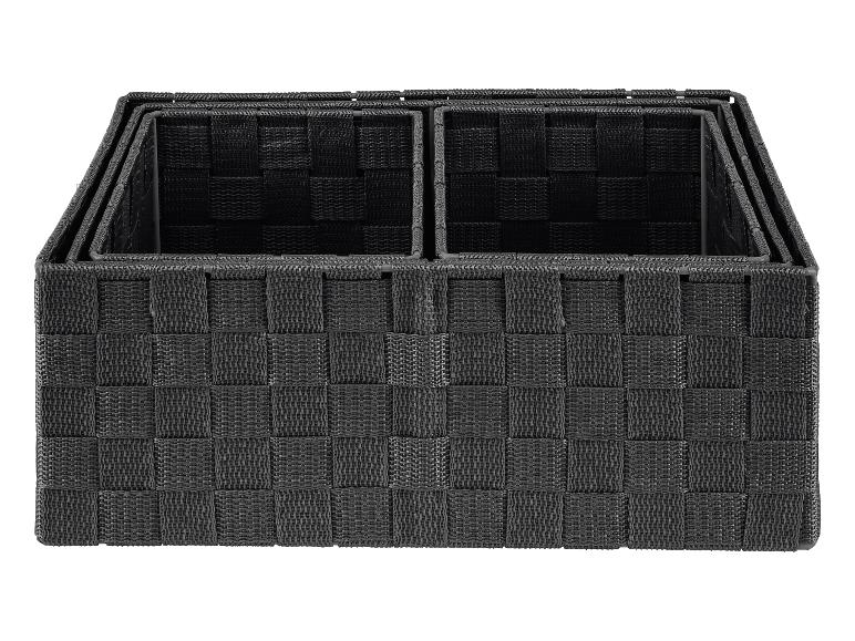 Trois paniers de rangement noirs de différentes tailles.