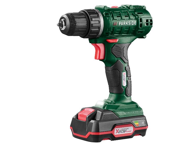 Perceuse sans fil avec batterie en vert, noir et rouge.