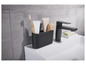 Un robinet de salle de bain noir avec un support noir pour brosses à dents et dentifrice.