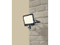 Projecteur extérieur LED avec détecteur de mouvement monté sur un mur en briques