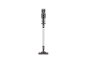 Aspirateur balai gris avec brosse pour sols sur fond noir.
