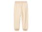 Pantalon de survêtement beige avec ceinture élastique.