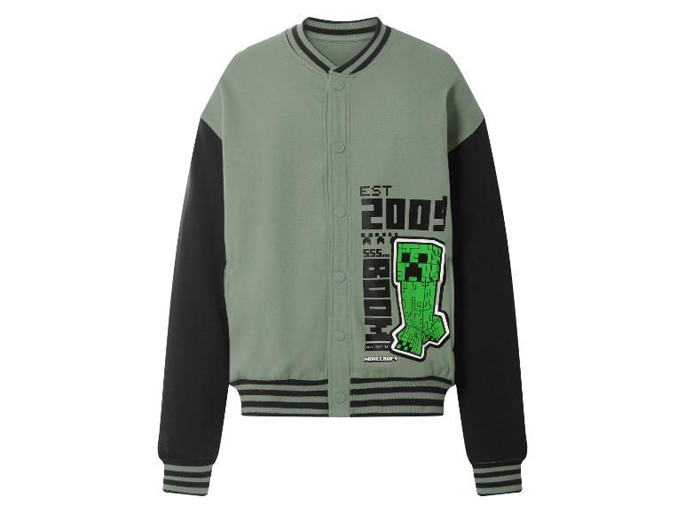 Blouson bomber vert et noir avec imprimé de personnage de jeu vidéo et texte « EST 2009 BOOM ».