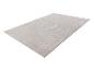 Tapis rectangulaire beige clair avec motif ondulé en relief.
