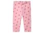 Legging rose à motif fraises.