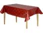 Nappe rouge avec motifs de Noël dorés sur une table en bois.
