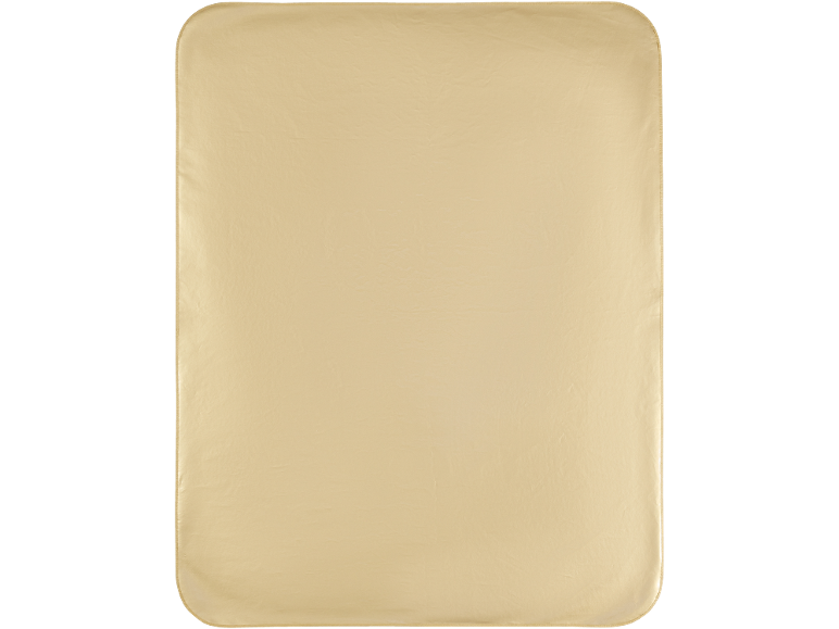 Une couverture rectangulaire beige clair aux coins arrondis.