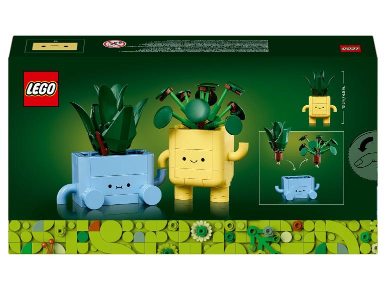Ensemble LEGO avec deux plantes à construire, une bleue et une jaune, avec des visages souriants.