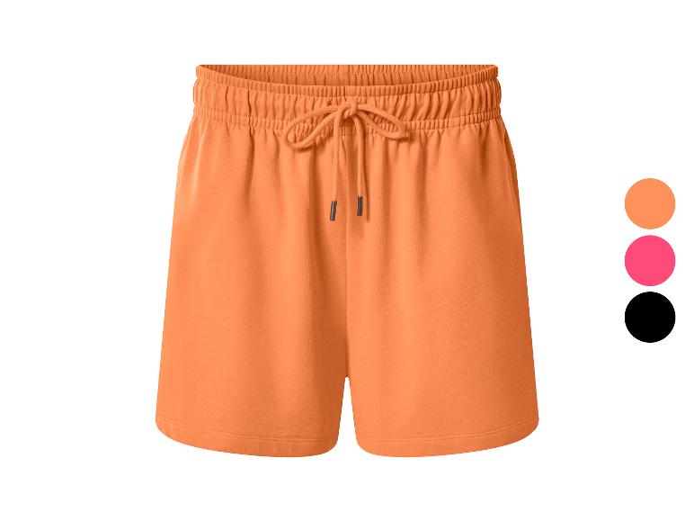 Shorts femme orange avec cordon de serrage réglable, également disponibles en rose et noir.