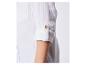 Chemise blanche en mousseline pour enfant, manches retroussables.