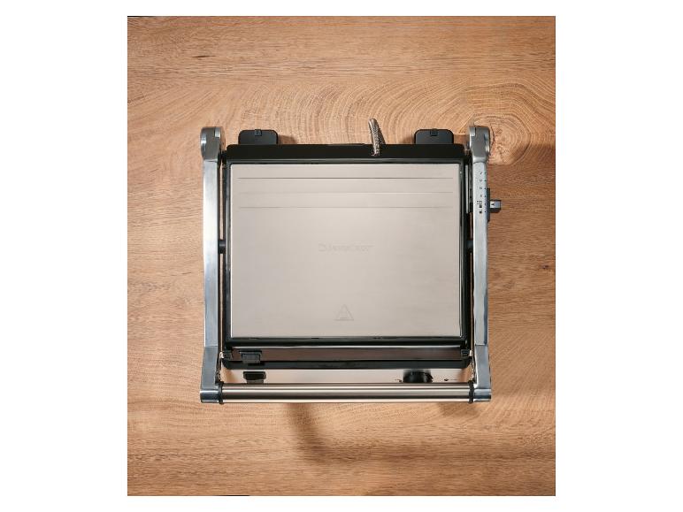 Grill de contact avec plaques de cuisson en acier inoxydable et contrôle de la température.
