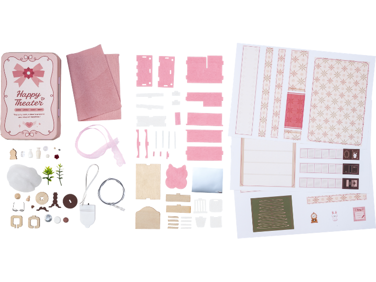 Kit de chambre miniature DIY avec boîte en étain rose, pièces en bois, tissu et découpes en papier.