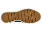 Semelle de chaussure de sport marron avec bordure blanche.