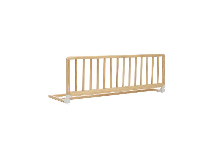 Barrière de lit en bois avec fixations blanches.