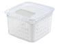 Une boîte de rangement blanche transparente avec un couvercle